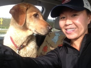 woman in car with dog