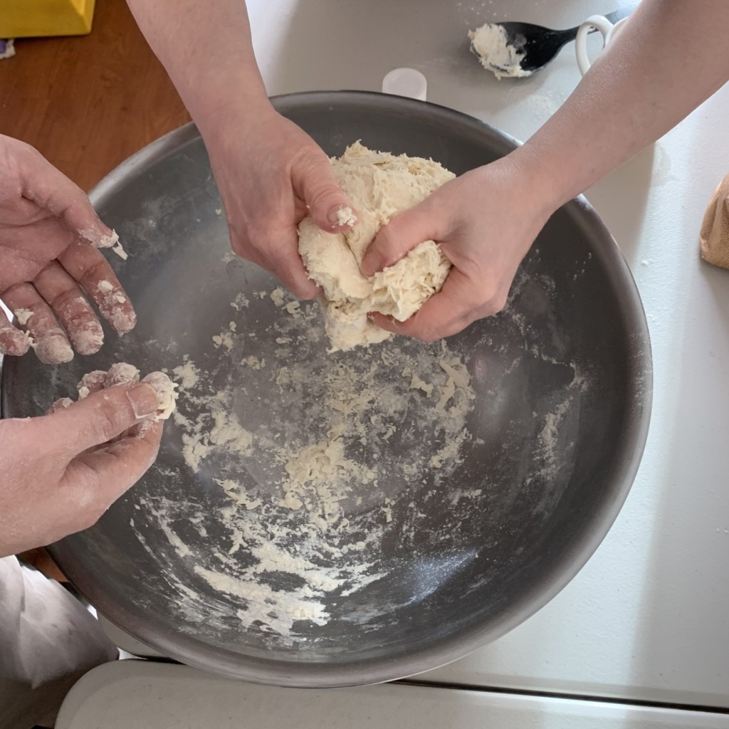 hands mixing dough