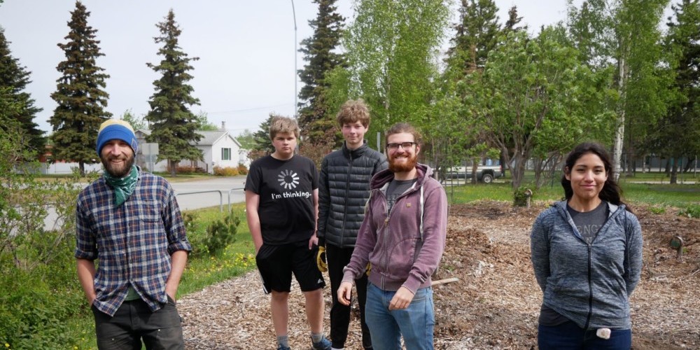 group standing near outdoor garden