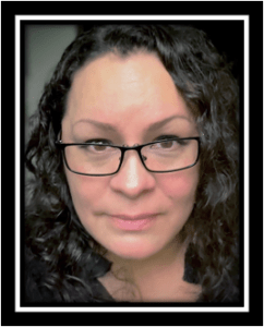 woman w dark curly hair & glasses