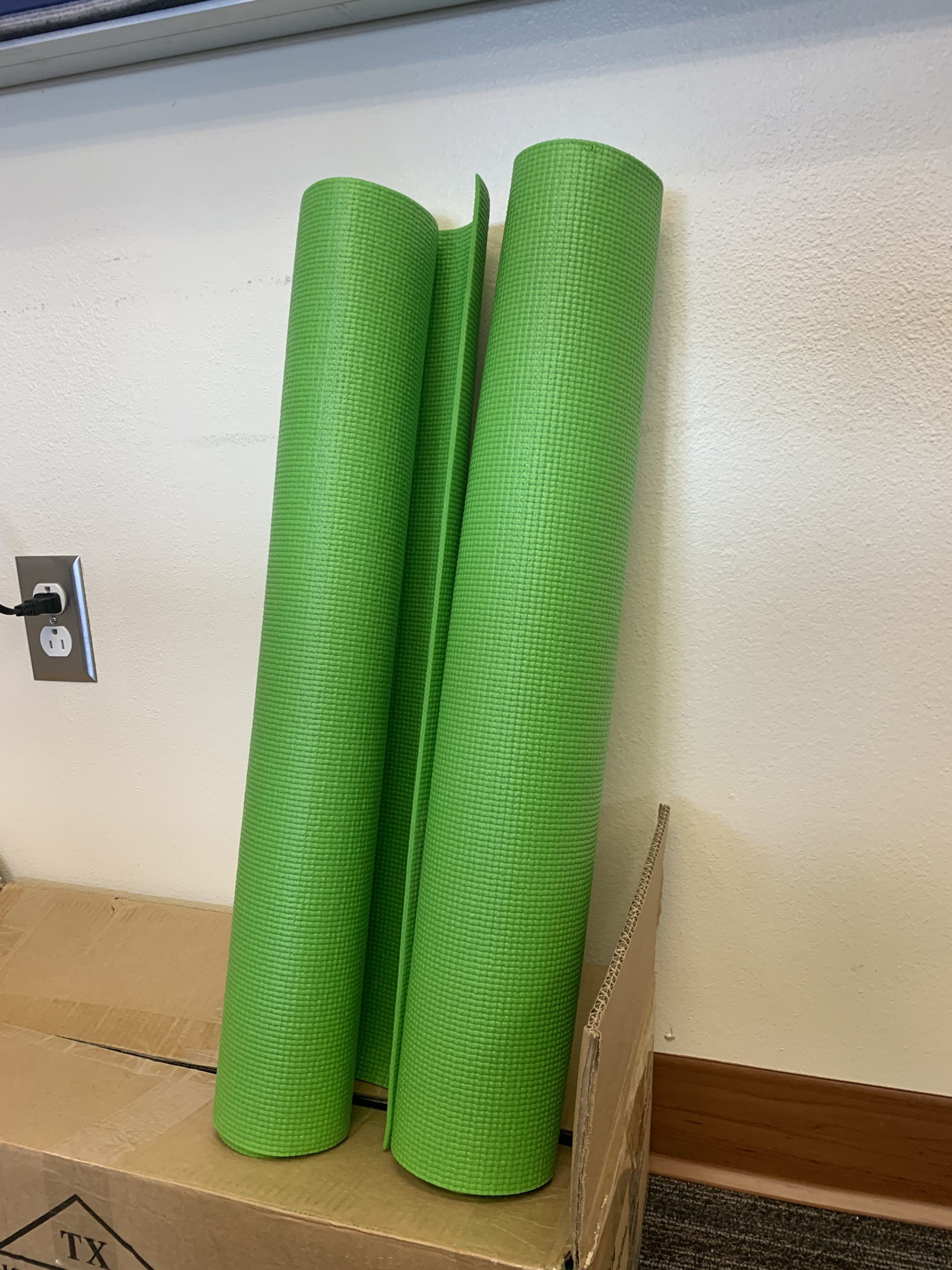 two rolled-up yoga mats